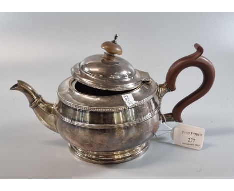 Silver baluster shaped teapot with turned wooden handle and finial.  Chester hallmarks.  16.5 troy ozs. approx.  (B.P. 21% + 