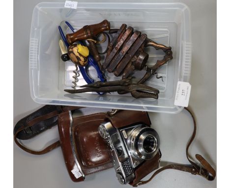 Plastic box of oddments, to include: Kodak vintage camera, corkscrews, including: J Heeley &amp; Son, crocodile nutcracker et
