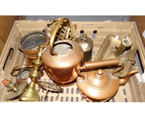 Box of copper and brassware: two copper kettles, brass trivets, copper ice bucket, old brass nightlight with candle pusher an