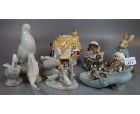 Collection of modern Beatrix Potter composition figurines by Border Fine Arts, together with a Nursery Rhyme Collection money