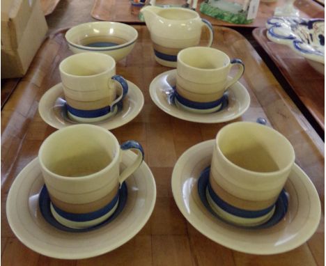 Tray of vintage Susie Cooper part coffee ware: four espresso cups and saucers, sugar bowl and milk jug decorated with brown a