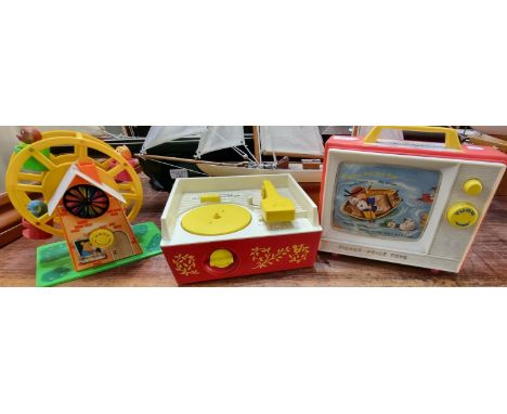 Two vintage Fisher Price toy items, to include: Giant Screen-Music Box TV and a Music Box record player together with another