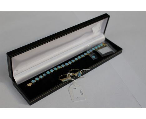 A 14ct gold bracelet set with synthetic opals, one opal missing but two spare opals - to match; together with a  matching opa