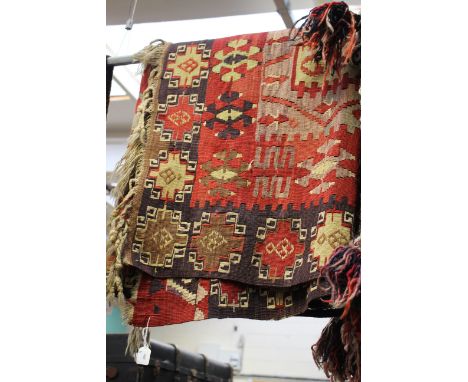 A woven rug, in terracotta, browns and light green, of geometric pattern, measuring approx 204 cms (80 inches) x 134cms (53 i