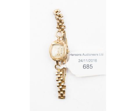 A 9ct gold ladies Rotary wristwatch on rolled gold chain 