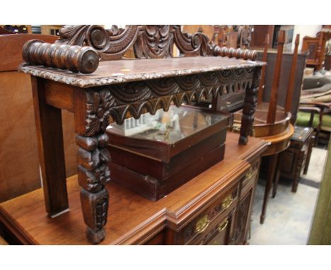 A Victorian oak hall bench, carved back, shaped apron *** carved legs 