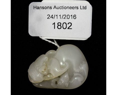 A Chinese carved jade pendant, modelled as a bat and rat on a gourd group, 3.5cm long
