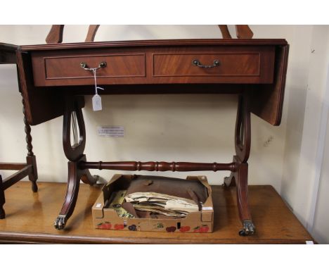 A reproduction mahogany effect sofa table, fitted with two drawers to front and two dummy drawers to back