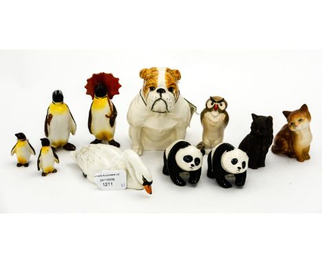 A Royal Doulton figure of a seated Bulldog, together with a Beswick Swan, model no 1685, two Beswick Panda cubs, model no 181