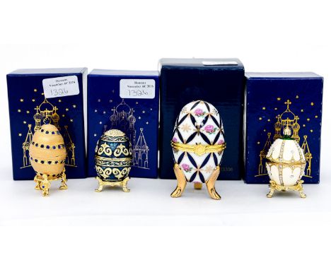 A pressed glass claret jug with metal collar, handle and lid and four boxed decorative eggs after Fabergé (5)