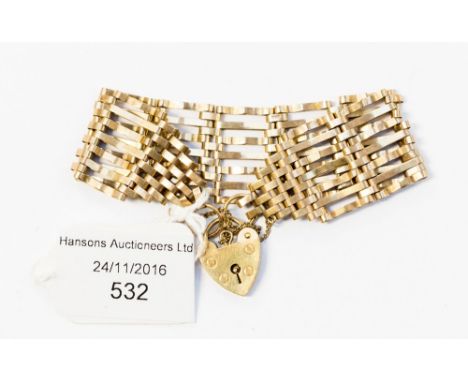 A gate bracelet, at widest extending to seven bars, 9ct gold with locket fastener, 15.4 grams approx 