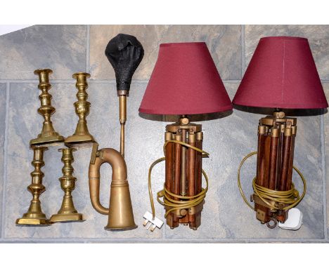 A pair of tripod table lamps, two pairs of brass candlesticks and a 1920s car horn (7)