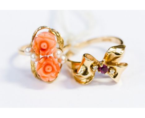 A 14ct ruby and diamond ring with a bow design size Q setting together with a 14ct gold pink coral and pearl ring, carved ros