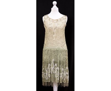 A 1920s Art Deco pale sage green flapper dress, embellished with silver bugle beads, white beads, silver sequins and imitatio