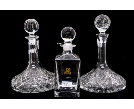 A pair of modern cut glass ships decanters; together with a Royal Crystal Rock square shaped Whisky decanter (3) 