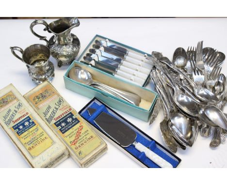 A quantity of Kings pattern cutlery.  Boxed knives and soup spoons together with ladle, teaspoons etc., and a white metal cre