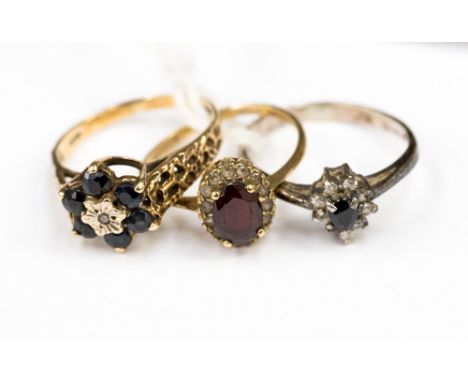 Two 9ct gold dress rings, a sapphire cluster and a garnet and white sapphire surround ring, size J and size M, total gross we