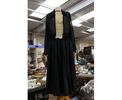 A good silk chiffon blouse with a gathered waistband, the neckline has a cotton lace cream insert and was purchased from Bour