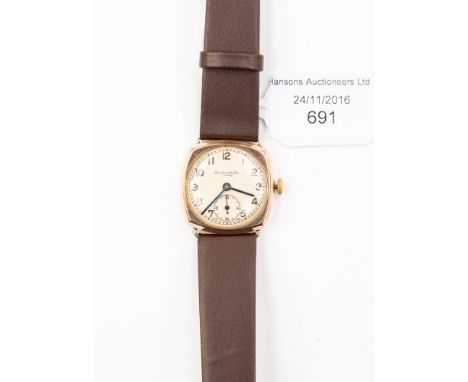 A vintage Thomas Russels and Son 9ct gold wristwatch on a leather strap, hallmarked for 1947 on a later Hirch strap Condition