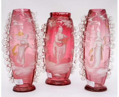 Three Cranberry style glass vases, a pair and a larger matching vase, all three are approx 30 cms high, twelve inches, have w