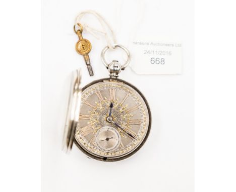 A silver Hunter London 1874, having engine turned face, gold Roman numerals, seconds hand, bevelled glass face (key) 