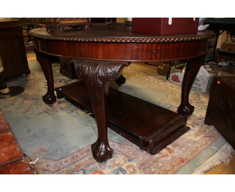 A mahogany Chippendale style extending table with two leaves and winder