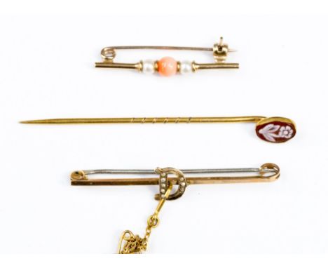 Two 9ct gold brooches to include a seed pearl set initial, coral and cultured pearl set; together with a cameo stick pin 