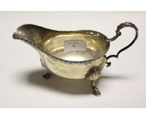 A late Victorian silver sauce boat, gadrooned border, hoof feet,maker William Hutton & Sons London 1900, 6.88 ozt approx 