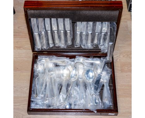 An eight setting Sheffield canteen of cutlery, bead pattern with addition fruit spoons, forks, tablespoon and ladle, with mah