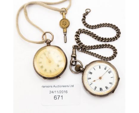 An Art Deco silver ladies fob watch, engine turned back, with a white enamelled dial, together with a further fob watch appro