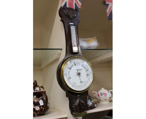 A 1930s oak barometer/thermometer and a Crouch & Son barometer (2)