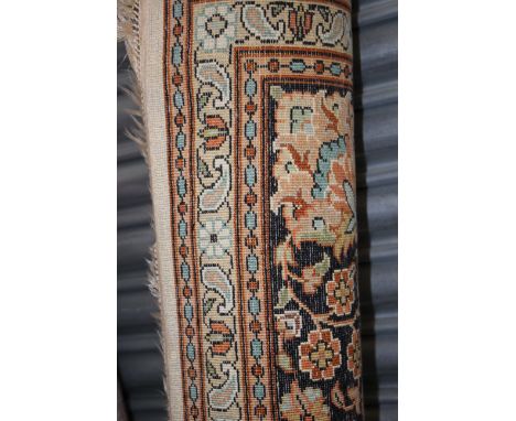 A Kashmiri carpet 6ft x 9ft with paperwork, wool double, pale background