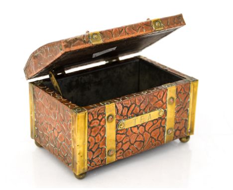 A copper tea caddy having embossed pattern and brass bound, dating from early 1950s (tin lined) 