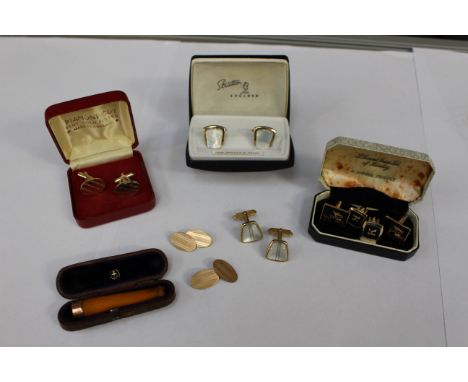 A pair of 12ct gold cufflinks, 5.7 grams approx, with an amber cheroot having 9ct gold tip and assorted cufflinks (one bag) 