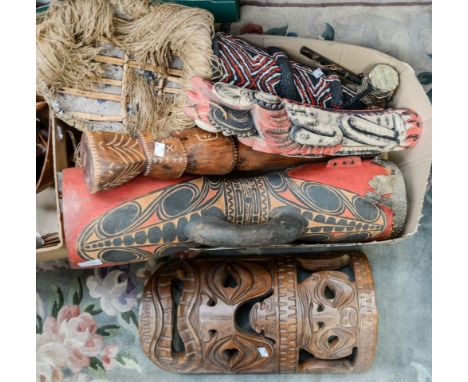 A carved hand painted drum, with snakeskin leather, together with other instruments, and masks, etc