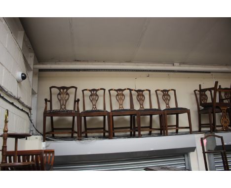 A set of eight George III style Shoolbred and Co mahogany dining chairs, in the manner of Thomas Chippendale, the backs with 
