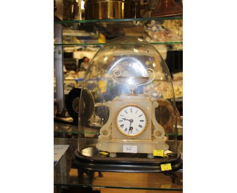 A late 19th Century marble mantle clock, having a white dial with black Roman numerals, plinth base