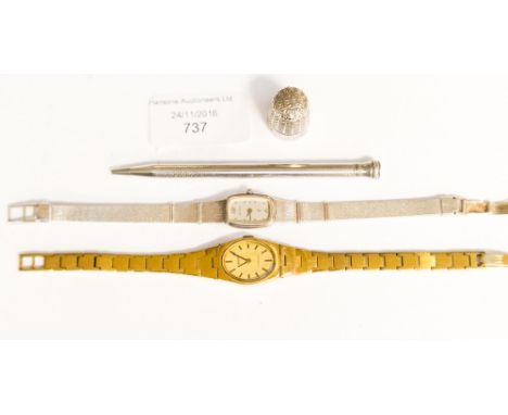 A lady's silver Aristo wristwatch, a Tissot wristwatch, silver pencil and a thimble (4) 