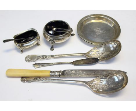 A pair of silver pierced spoons, Sheffield 1938, with a pair of silver trinket dishes, Birmingham 1902 (Walker and Hall) two 