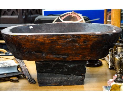 A hardwood trough, with a large opening in the centre, 38cm high, 82cm wide, 72cm deep