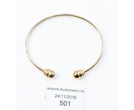 A 9ct gold torque bangle acorn terminals, 6.5 grams approx 