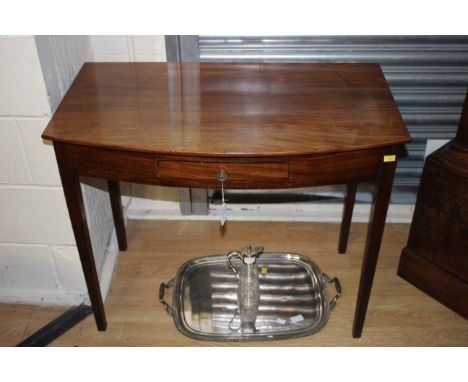 A 19th Century mahogany side table fitted with a single drawer, square tapered legs, 73 cm high, 86 cm wide, 49 cm deep appro