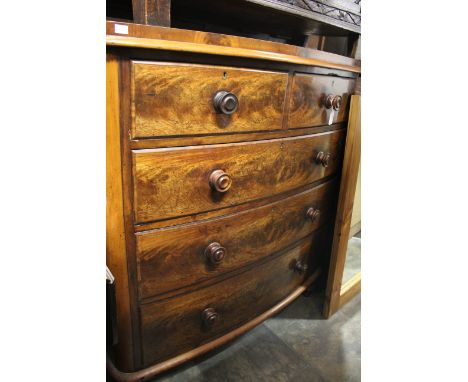 A Victorian mahogany bow fronted chest of drawers, two short over three long graduated drawers 