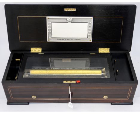 A 19th Century Swiss musical box, signed Ducommum Girod on top of the brass winding lever, also stamped 3307 and a second ser