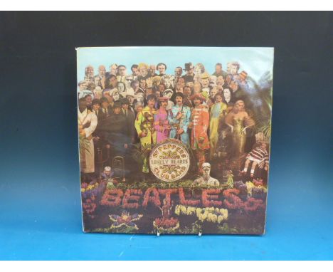 THE BEATLES "Sgt Pepper's Lonely Hearts Club Band", Stereo (PCS 7027) first pressing.  Complete with cut-out inner and White 