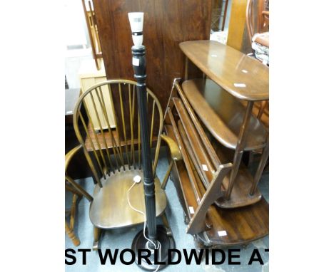 An Ercol tea trolley, rocking chair, shelf rack and a dark wood standard lamp