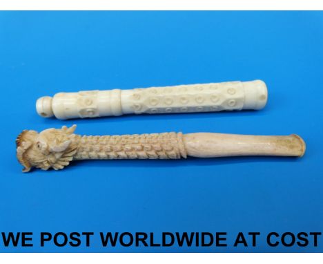 A Chinese carved ivory cheroot holder and a bone needlecase