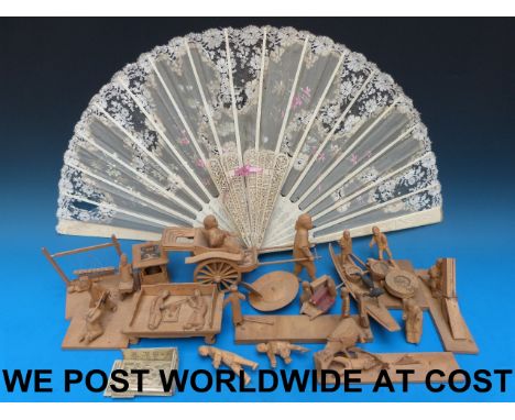 A quantity of carved Oriental figures, two ivory / bone fans etc