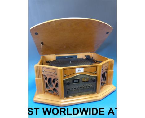 A reproduction Deco style oak record player, CD and cassette player