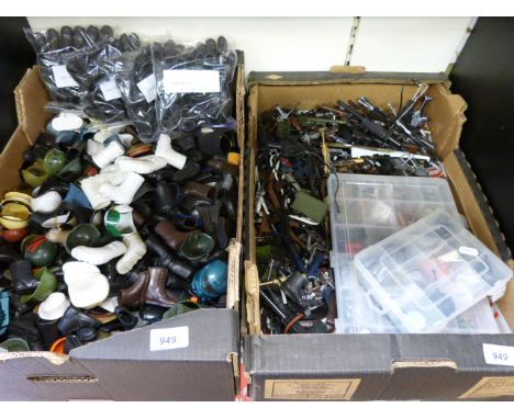 A large collection of Action Man accessories including boots, helmets, guns etc